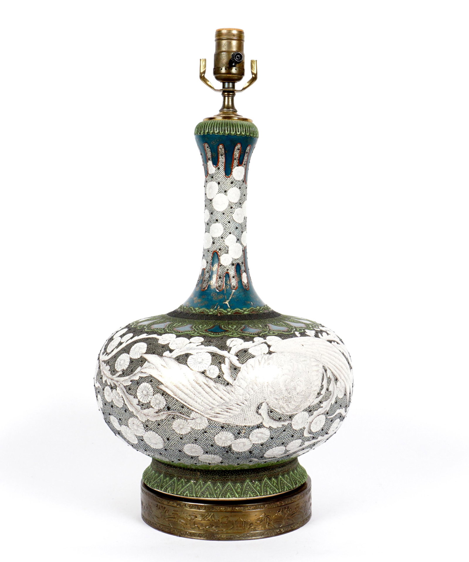 Japanese Porcelain Phoenix Decorated Lamp: Squat bottle form porcelain body, white enamel phoenix bird and floral decoration. Embossed brass collar base, single socket fixture. Overall 21" h. x 11.5".