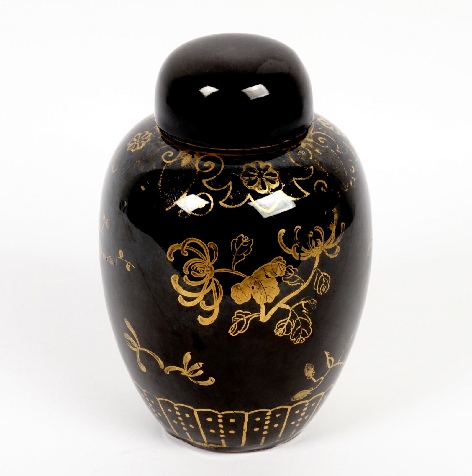 Chinese Mirror Black Gilt Decorated Ginger Jar: Ovoid form ginger jar, mirror black glaze, gilt foliate decoration, apocryphal Kangxi mark to base, overall 8" h. x 5". Condition: Wear to decoration.