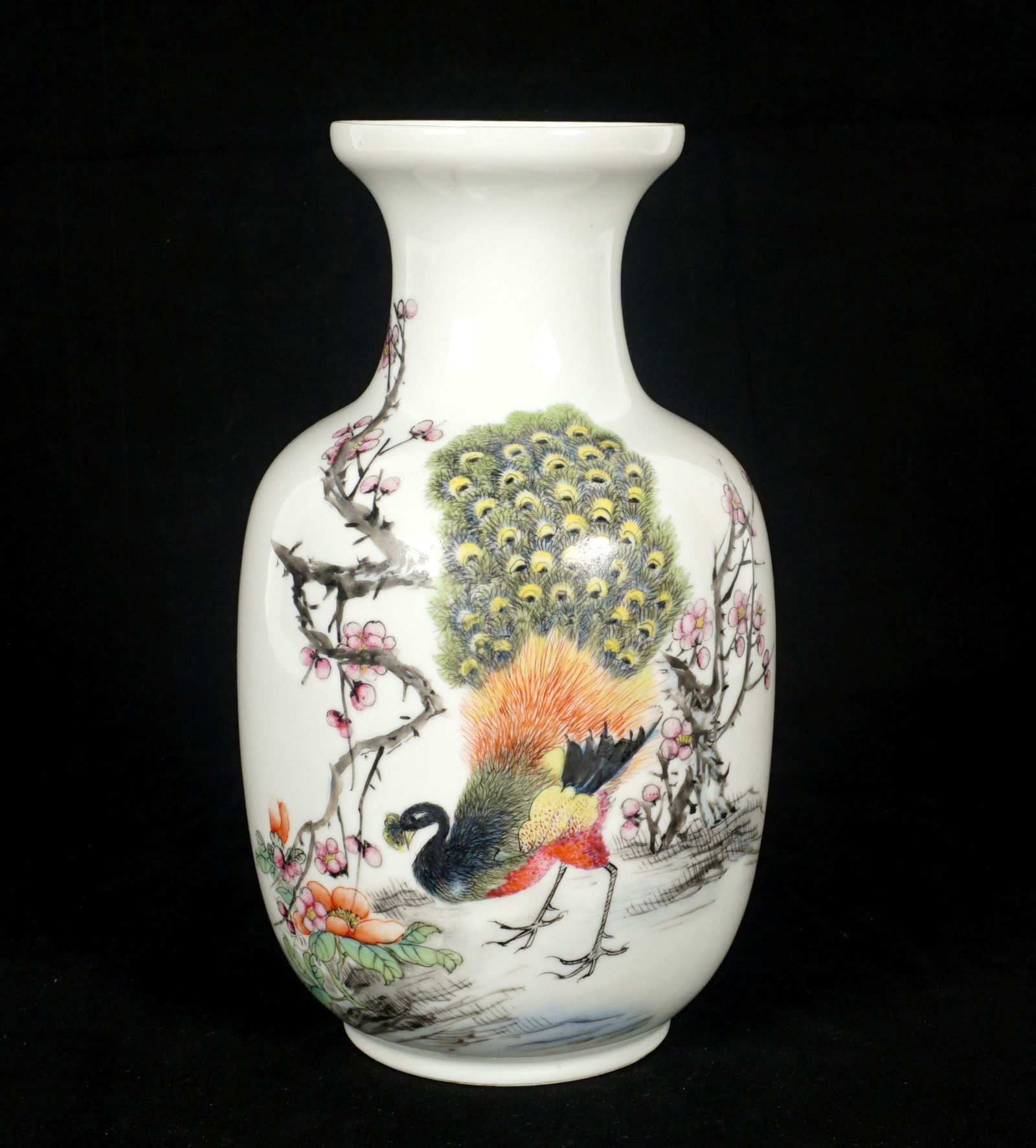 Chinese Republic Period Famille Rose Peacock Vase: Baluster form vase, peacock in landscape scene, red Hongxian mark to base, overall 8" h. x 4.5".