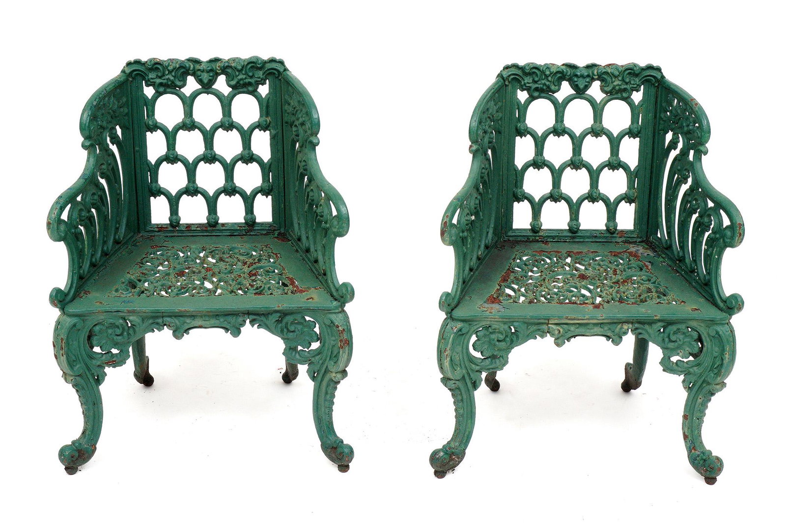 Pair Victorian Green Painted Cast Iron Chairs: In the manner of Carron in the Gothic Revival style, most likely American, extremely heavy cast iron painted green, overall 35.25" h .x 27.5" x 20". Condition: Paint flaking, rust, obvious signs of we