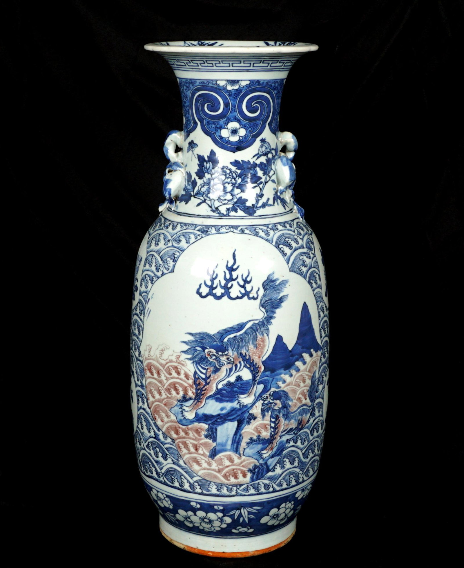 Chinese Polychrome Decorated Floor Vase: Baluster form floor vase, applied fruit handles; white ground with blue and red underglaze decoration, floral and crashing waves; Qilin in landscapes in reserves. Paper labels on base, overall 23.75"