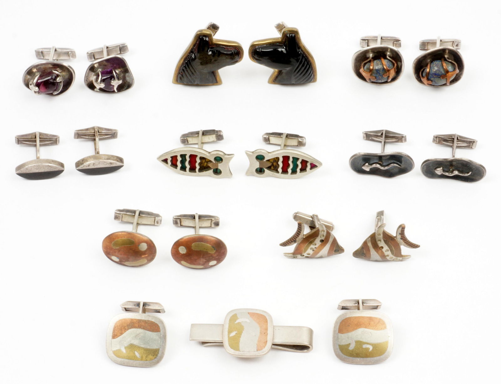 9 Pair Lost Castillo Mexican Sterling Cufflinks: Nine pair total by Los Castillo, sterling and mixed metal construction, to include onyx horse head, modernist squiggle, stone inset owl, amethyst set, blue stone set, mixed metal fish, mixed metal ova