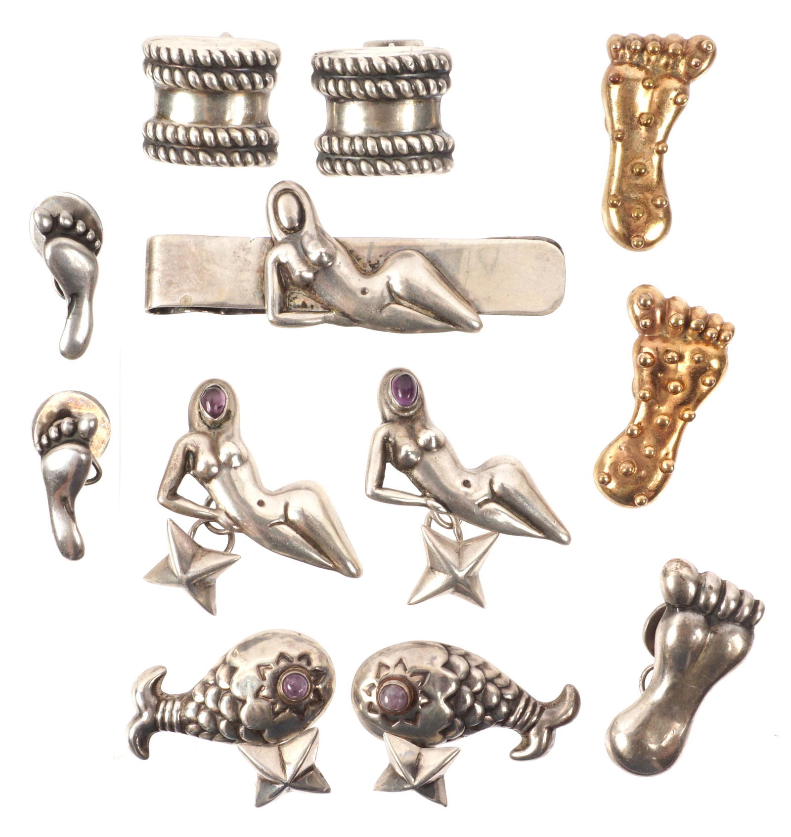 5 Pairs Hubert Harmon Mexican Sterling Cufflinks: Five pairs total from Hubert Harmon to include amethyst face nude women, amethyst eye fish, large brass feet, small feet, rope twist bands. Sold with a extra large silver foot cufflink and a nude woma