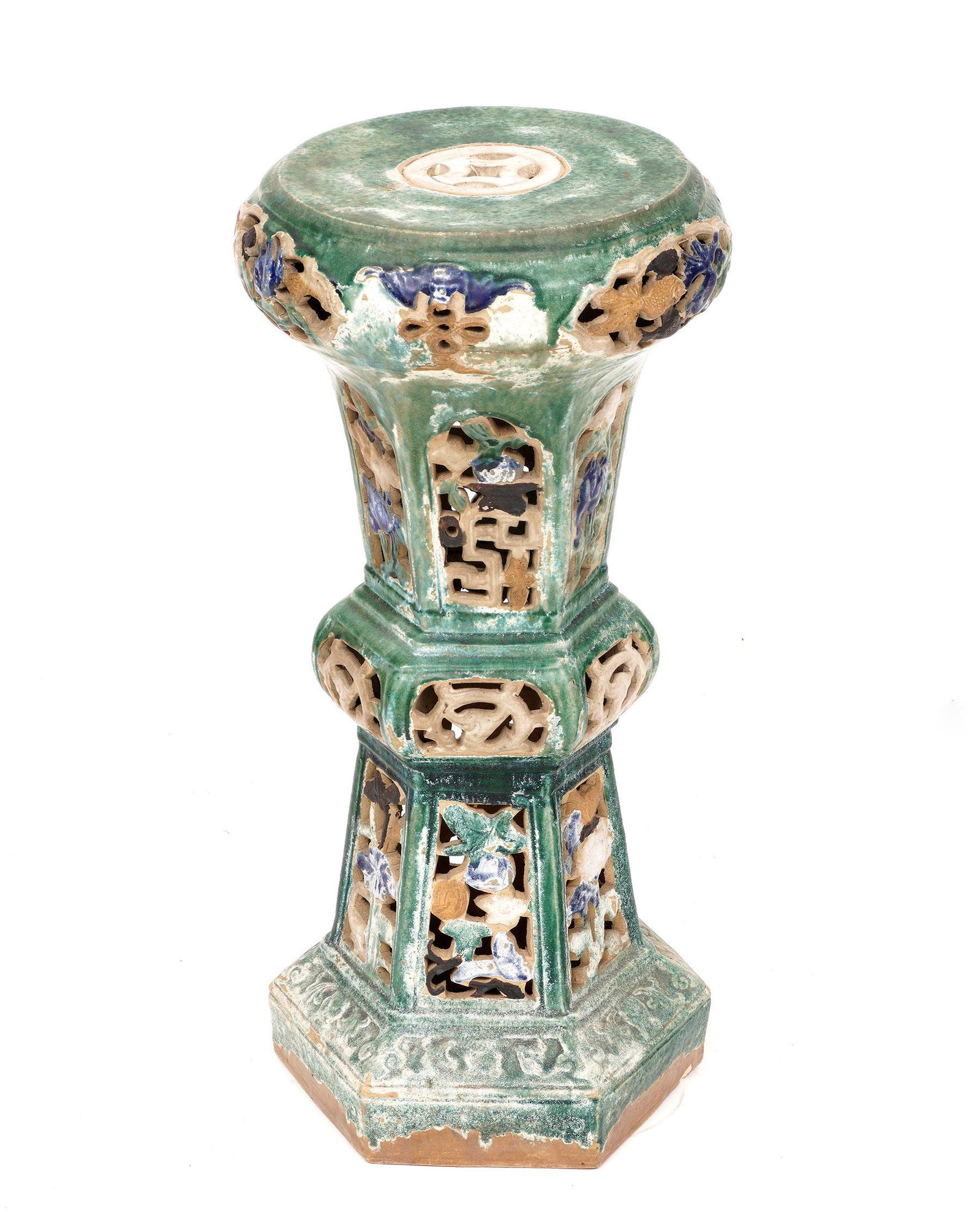 Chinese Polychrome Reticulated Pottery Pedestal: Earthenware pedestal, green ground, reticulated floral designs, overall 30.25" h. x 14" top dia. Condition: Chips and wear to decoration.