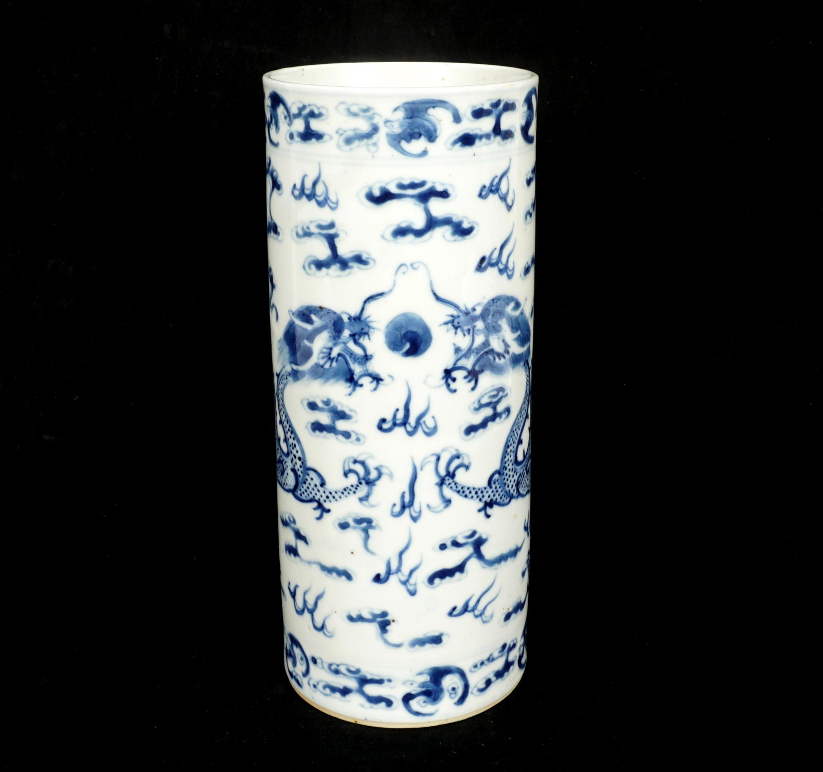 Antique Chinese Blue & White Dragon Cylinder Vase: Tall cylinder vase or hat stand, blue and white decorated with two dragons, smoke, fire, and bats, Qianlong four character mark to base. Overall 10.5" h. x 4.25" dia. Sold with IM Chait paperwork.