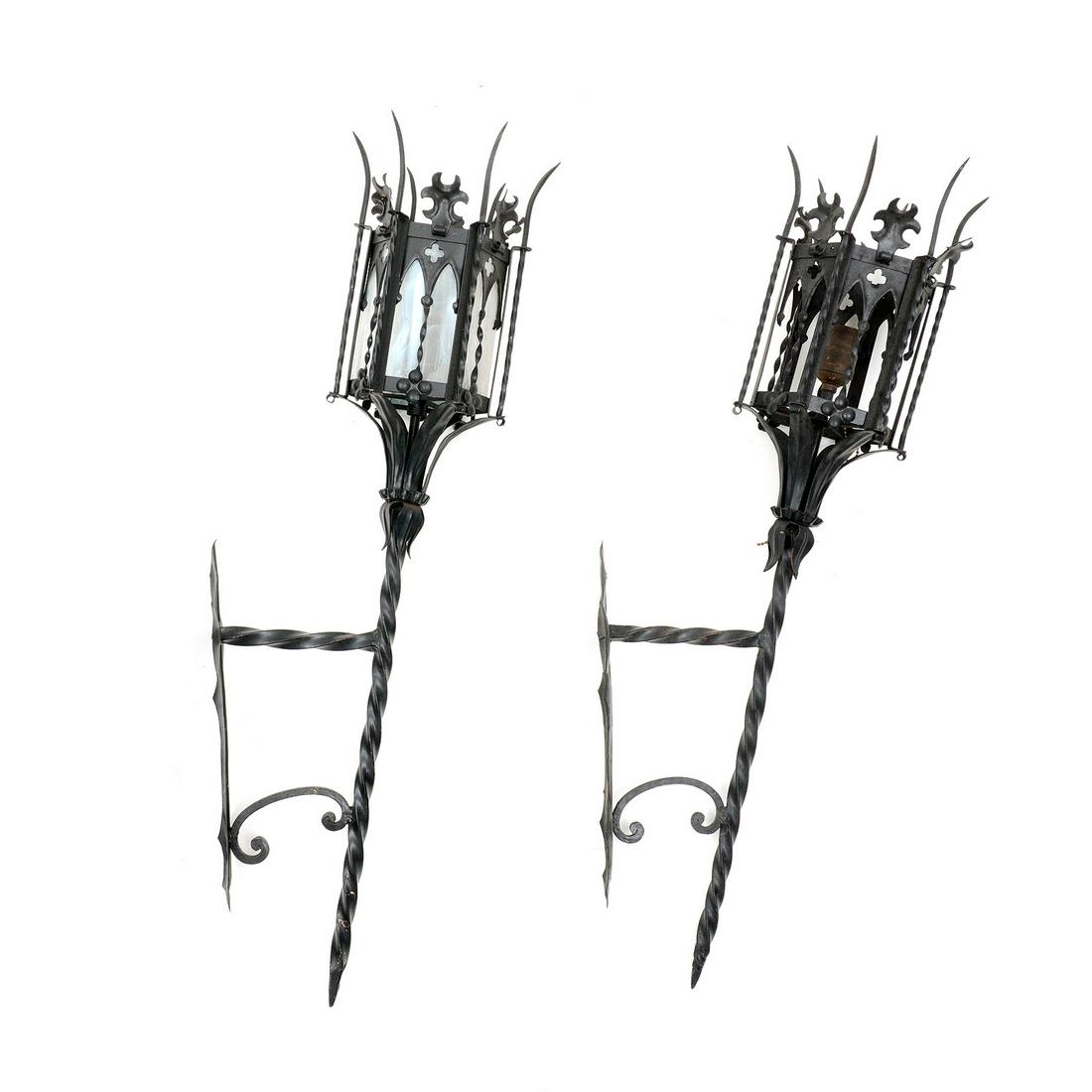 Pair Mizner Style Wrought Iron Wall Sconces: Renaissance revival torch sconces in the style of Addison Mizner, wrought iron frame, hexagonal shades, twist metal bodies, electrified. Overall 35" h. x 6.5" x 11". One sconce missing all glass inser