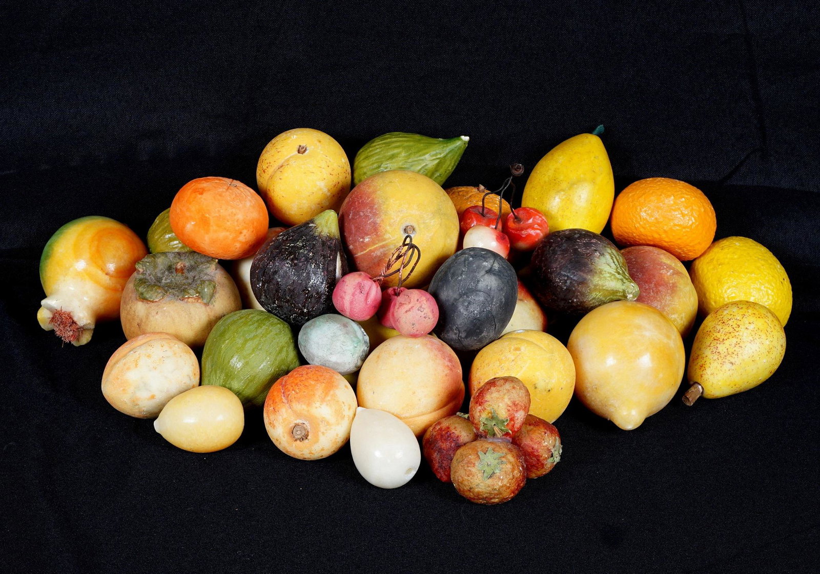 Collection of 33 Vintage Stone Fruit: An assembled collection of 33 pieces total to include cherries, peaches, apples, pears, figs, lemon, and more. Largest 2.75" dia.