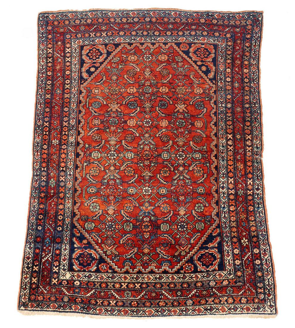 Antique Persian Lilihan Rug: Five floral and geometric border bands, rust red center ground wit blue ground corners, floral spray center, 6' 5" x 4' 8". Please see photos for condition