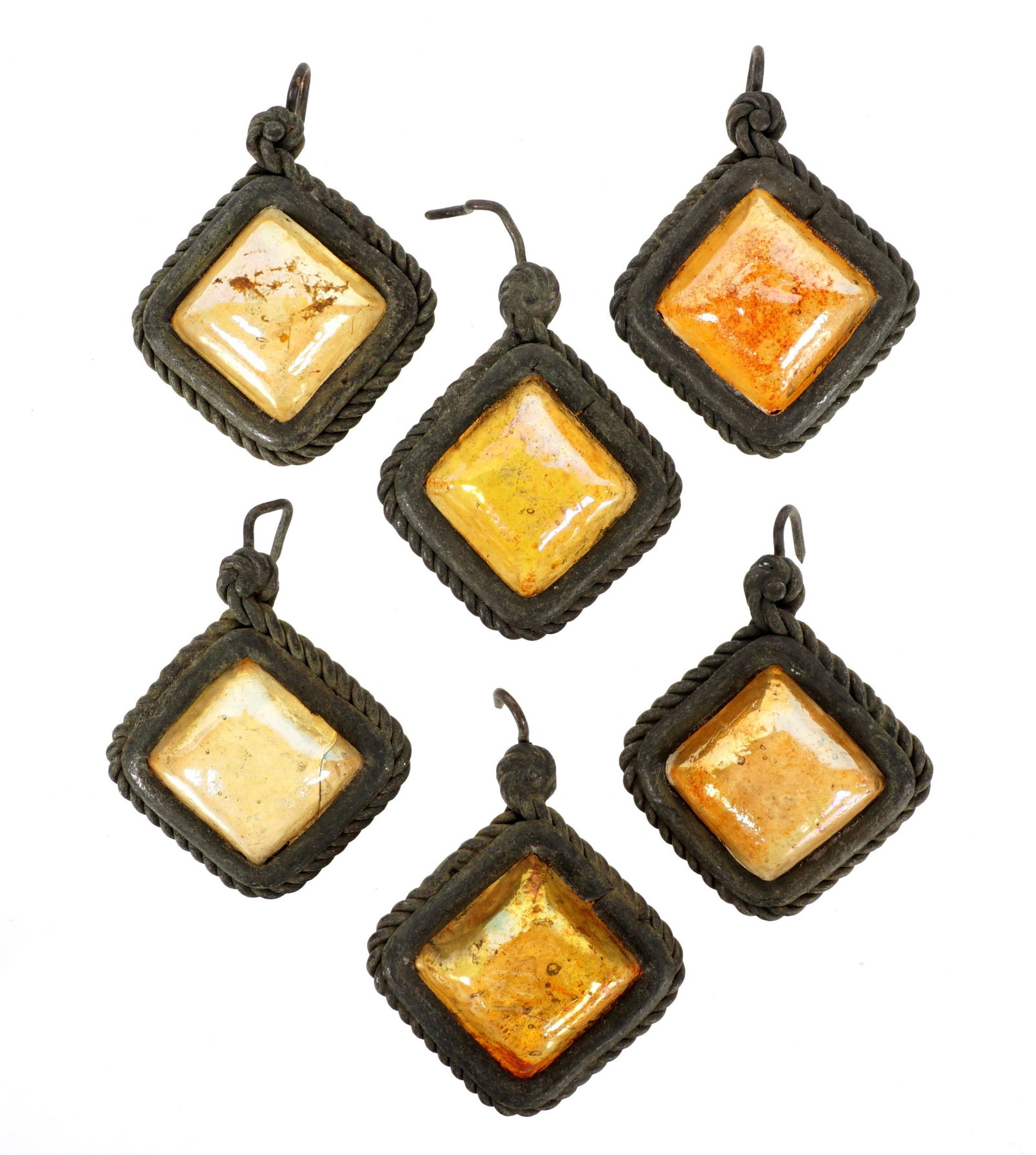 6 Tiffany Favrile Glass & Bronze Lamp Teardrops: A lot of 6 Tiffany Favrile glass and bronze teardrops from lamp. Each measures approximately 0.5 inches deep by 1.12 inches across (not including corner hook.) Condition: Various signs of age and wear