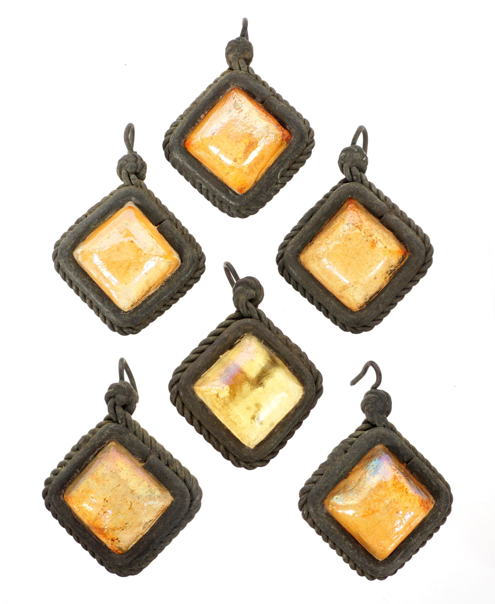 6 Tiffany Favrile Glass & Bronze Lamp Teardrops: A lot of 6 Tiffany Favrile glass and bronze teardrops from lamp. Each measures approximately 0.5 inches deep by 1.12 inches across (not including corner hook.) Condition: Various signs of age and wear