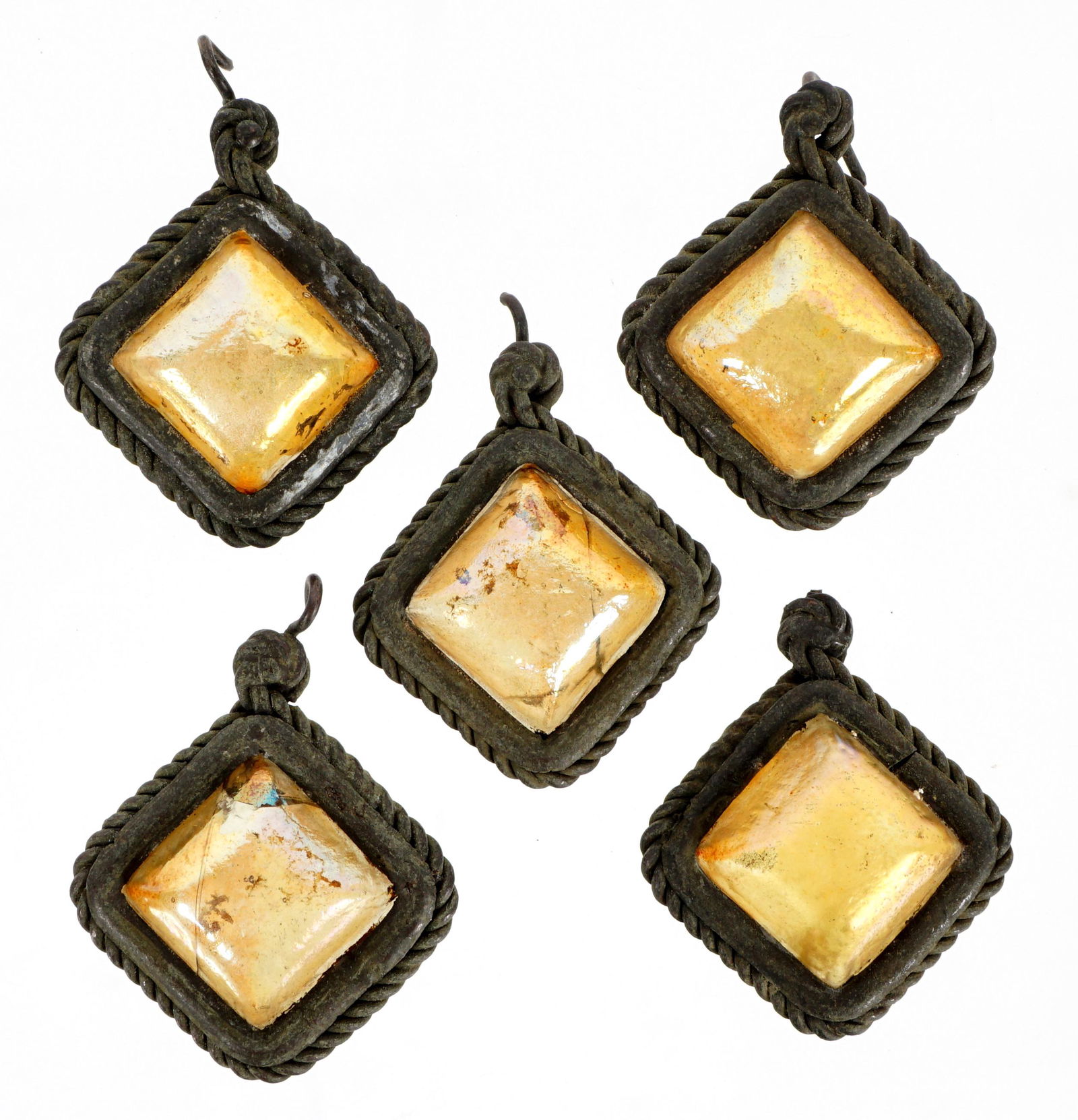 5 Tiffany Favrile Glass & Bronze Lamp Teardrops: A lot of 5 Tiffany Favrile glass and bronze teardrops from lamp. Each measures approximately 0.5 inches deep by 1.12 inches across (not including corner hook.) Condition: Various signs of age and wear