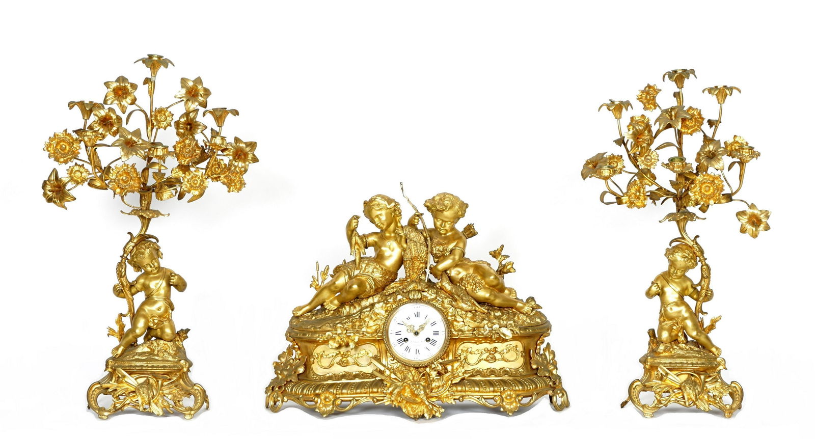 3 pc Large French Gilt Bronze Clock Garniture Set: Large gilt bronze mantle clock with figural putti crest, one with bow, arrow, and rabbit, the other holding fish, ornate cast lower half, center lower stand of arms with game birds, on foliate scroll