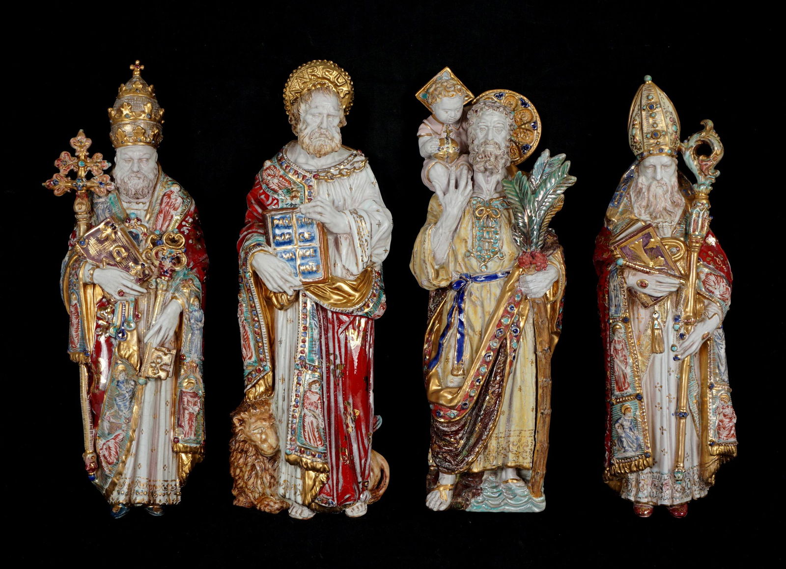 Four Eugenio Pattarino Terracotta Wall Icon Saints: An assembled collection of four Italian polychrome decorated wall icons, each signed Prof. E. Pattarino, Italy, with mold numbers, 14.5" x 4.75" x 2". From the estate of a prominent lawyer from New Ro