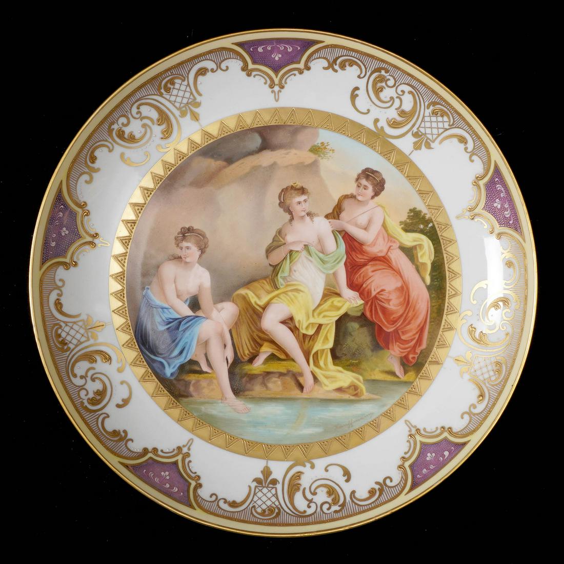 Royal Vienna Style Nymphs Porcelain Charger: Hand painted depiction of three maidens at waters edge, white ground, gilt accents, green beehive mark verso, 2" h. x 13.5". Condition: Inpaint to arm, minor loss of decoration. From the estate of a p