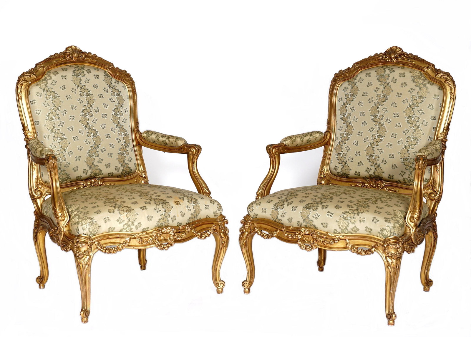 Pr 19th C French Carved Gilt Wood Fauteuil Chairs: Carved and shaped gilt wood frames, center shell crest top rail, shaped open arms and skirt, carved foliate scroll and floral garland motifs, cabriole legs ending in scroll feet. Green / grey foliate