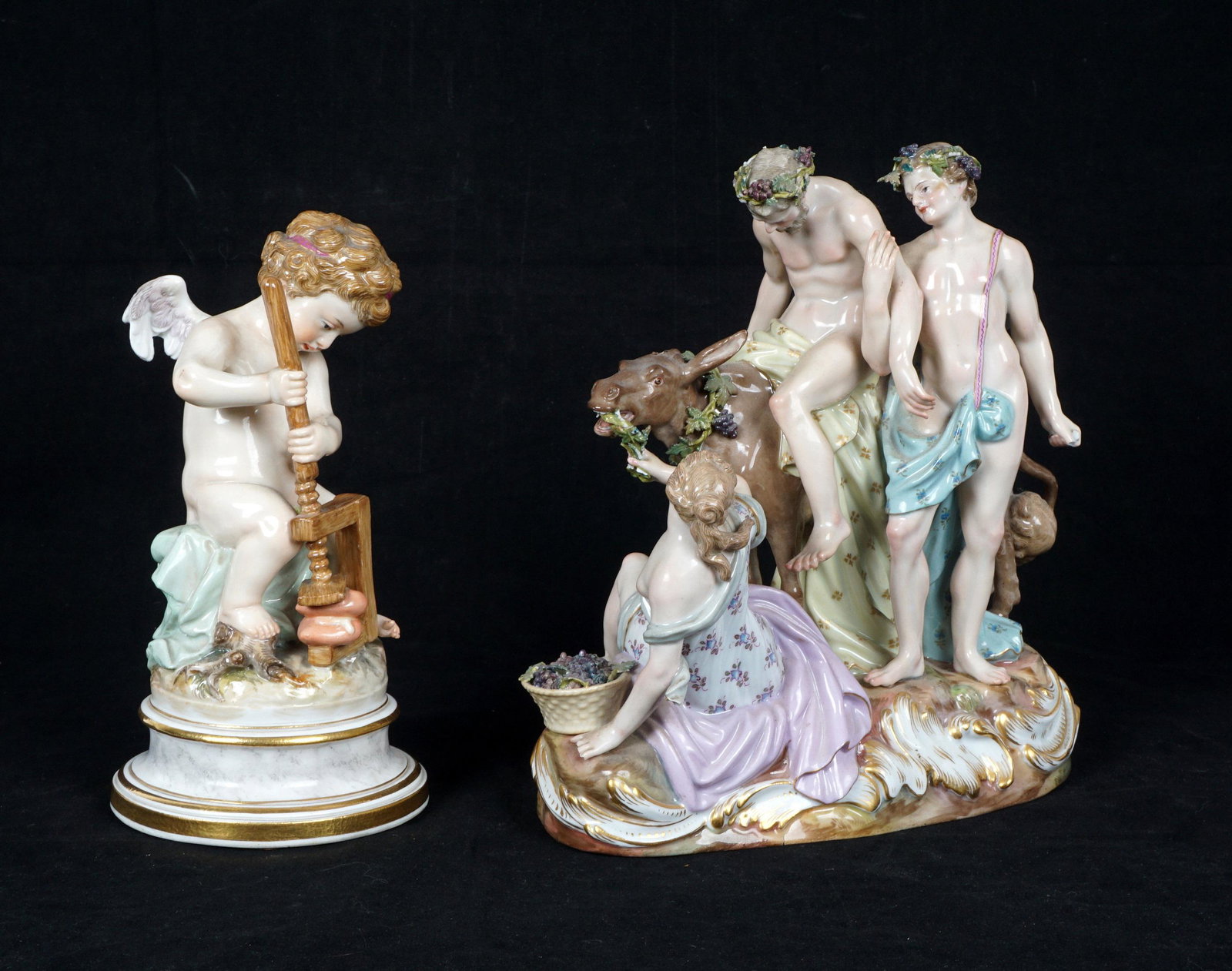 Two Meissen Porcelain Figural Groups: Two pieces total to include 1) Silenus Astride a Donkey, blue crossed sword mark, incised No, 2424, overall 8" h. x 8" x 4.75". Chips and losses including one donkeys ear. 2) Cupid with heart in vice,