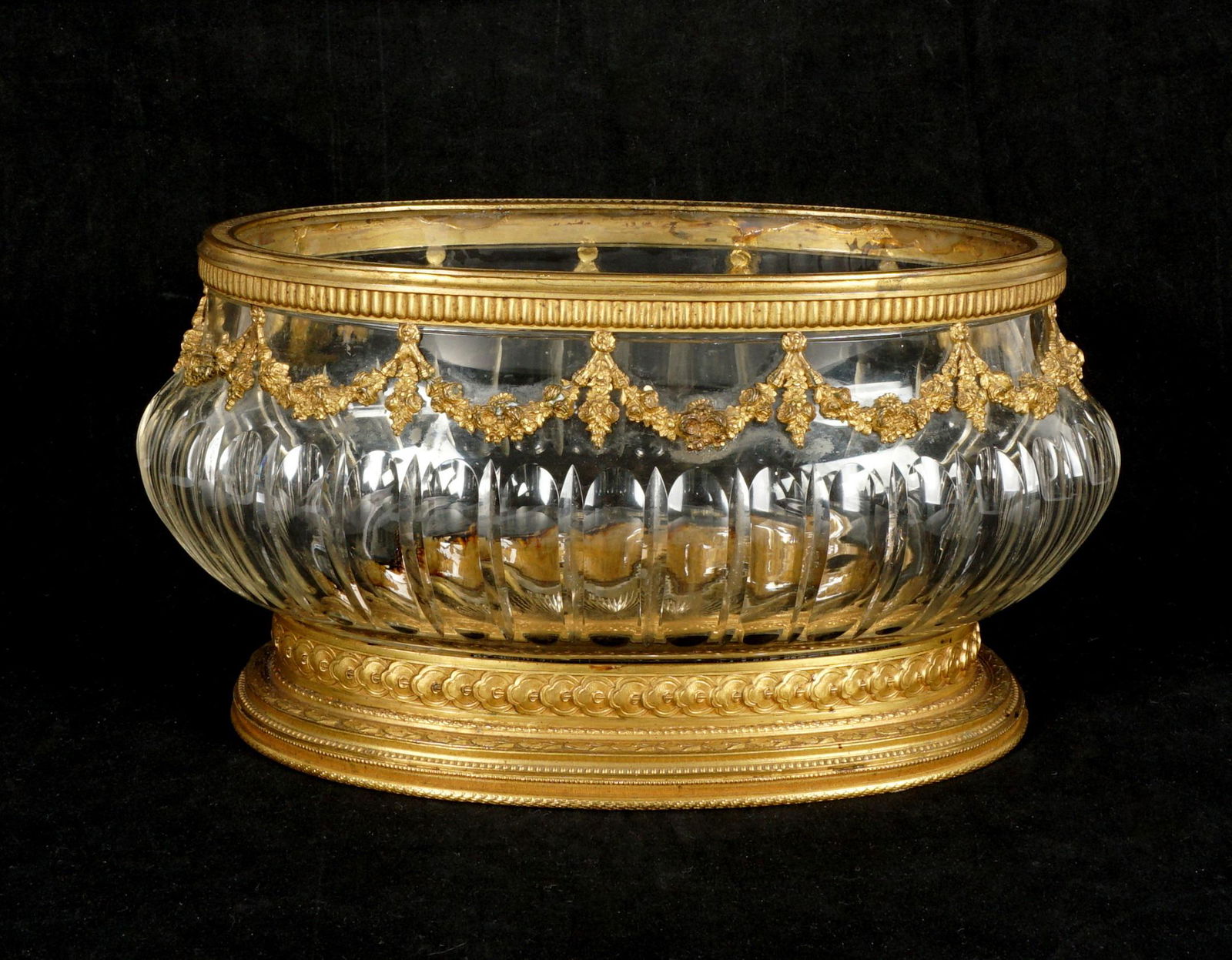 Baccarat Bronze Mounted Crystal Centerpiece: 19th Century, bronze mounted rim over floral garland decoration, cut crystal body, bronze base and foot, no visible markings, 5.25" h. x 10.5" x 6.75". From the estate of European collector Mark Melam