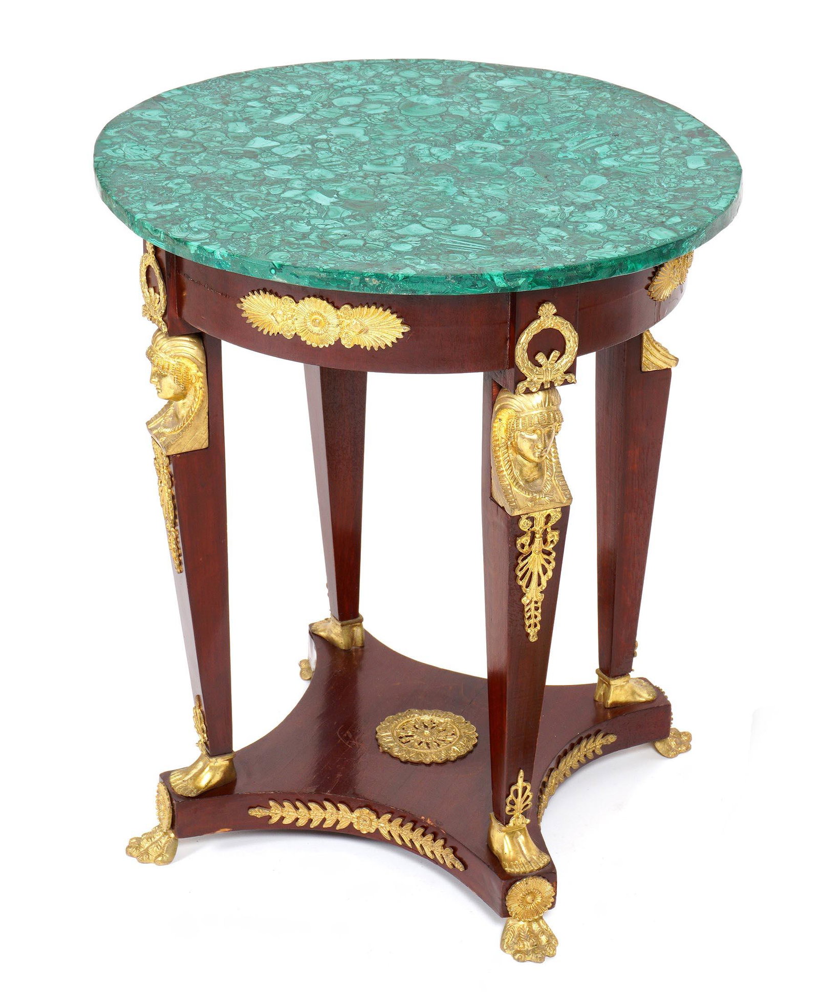French Empire Style Malachite Top Table: Round malachite veneer top, skirt with applied gilt metal decoration, four tapered supports with gilt metal masks at top, feet at base, splayed base, all on four gilt metal feet. Overall 28.5" h .x 24
