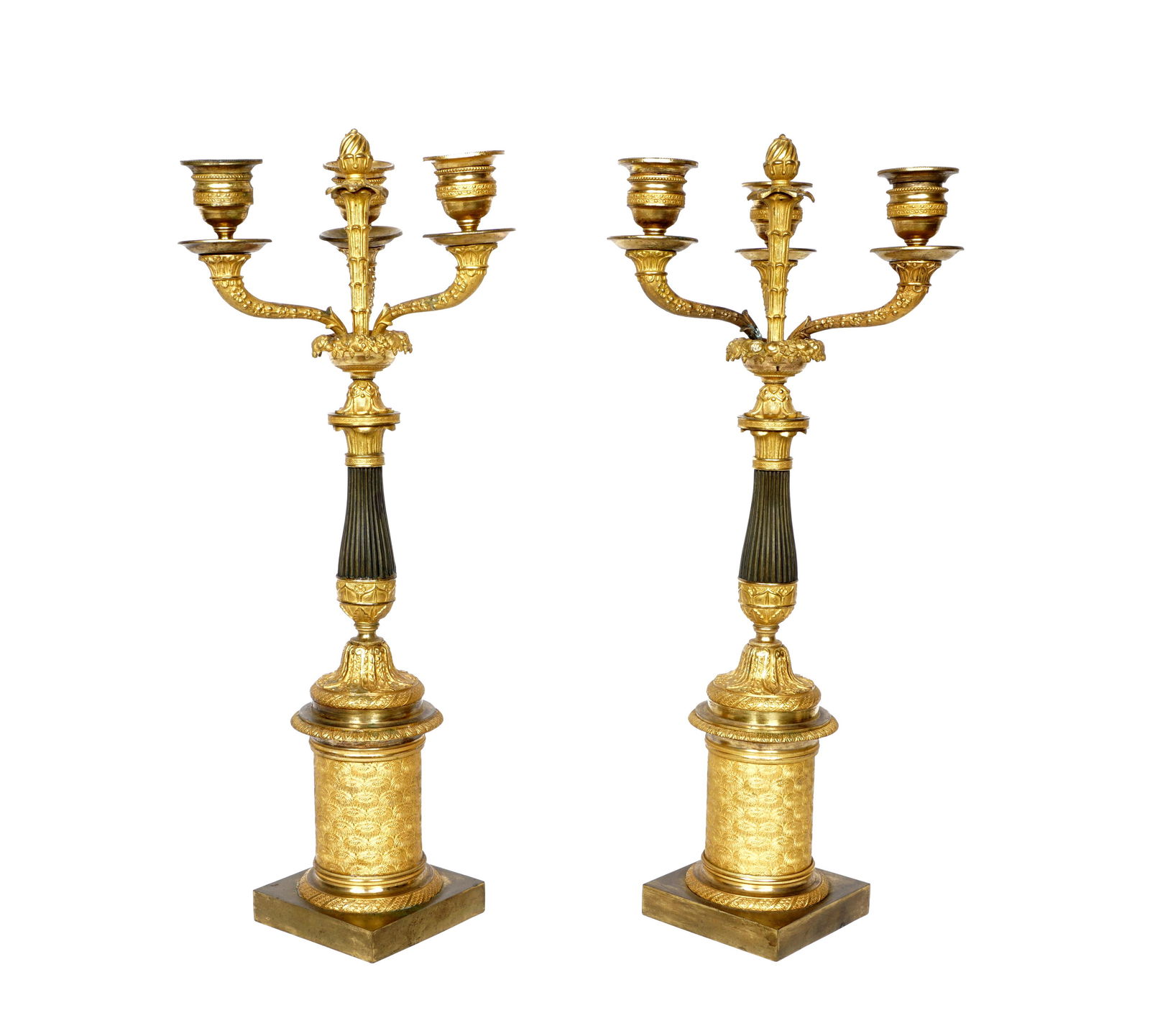 Pair Charles X Parcel Gilt Bronze Candelabra: Three arms, center spire decoration, fluted shaft, lower pedestal over square base. No visible markings, overall 16.75" h. x 6.75". From the estate of European collector Mark Melamud M.D. Condition: B