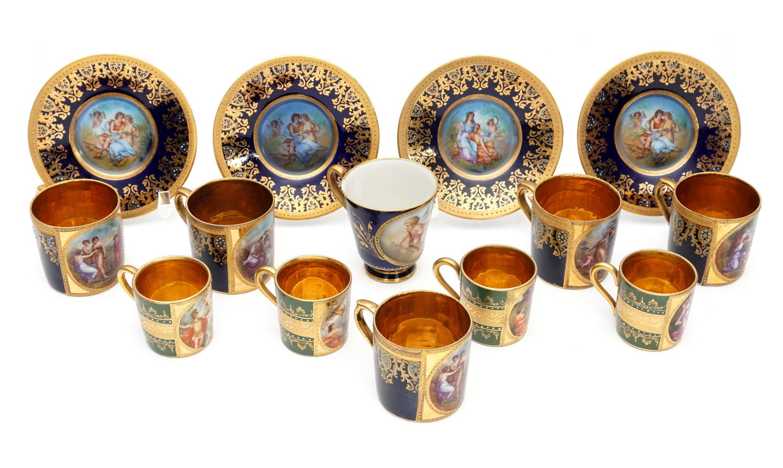14 Royal Vienna Demitasse Cups and Saucers: An assembled collection of 10 assorted demitasse cups with hand painted reserves, gilt accent decoration and interiors, tallest without gilt interior 2.5" h., smallest 1.75". Four saucers with hand pa
