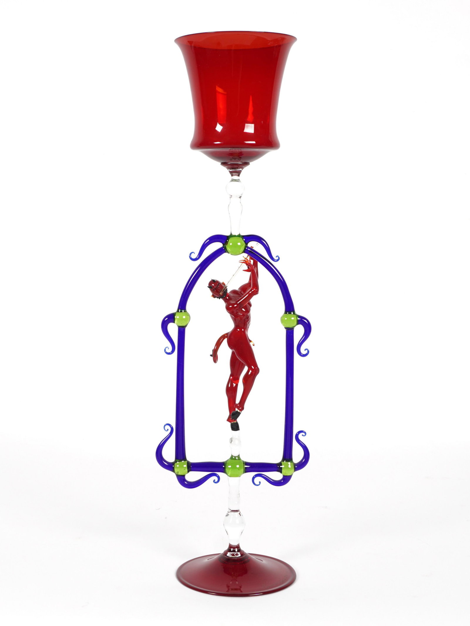 Lucio Bubacco Murano Glass Devil Goblet: BUBACCO, Lucio, (Italian, 1957-): Ruby red goblet over figural devil playing a flute framed in blue an green glass, ruby foot, signed and dated '93. Overall 19" h. x 5.5". From the estate of a promine