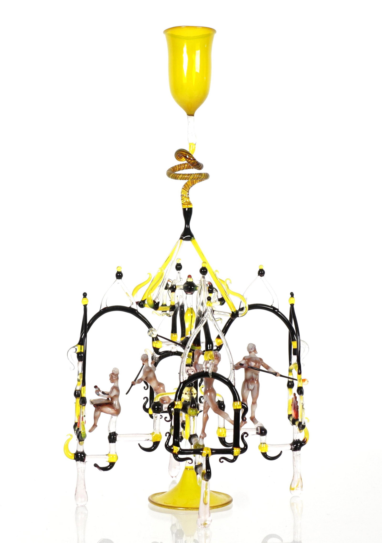 Lucio Bubacco Murano Art Glass Sculpture: BUBACCO, Lucio, (Italian, 1957-): Small yellow cordial glass above intricate figures of glass blowers in various positions, yellow foot, signed on foot. Overall 10.25" h. x 5" dia. Shippers note: Frag