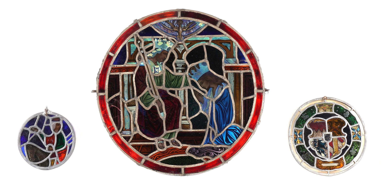 Three Round Leaded Stained Glass Windows: Three pieces total to include 1) Depiction of royal couple, 24" including support stretcher, two cracked panels. 2) Heraldic shield, 11" dia. 3) Man on horse, 8" dia. From the estate of a prominent la