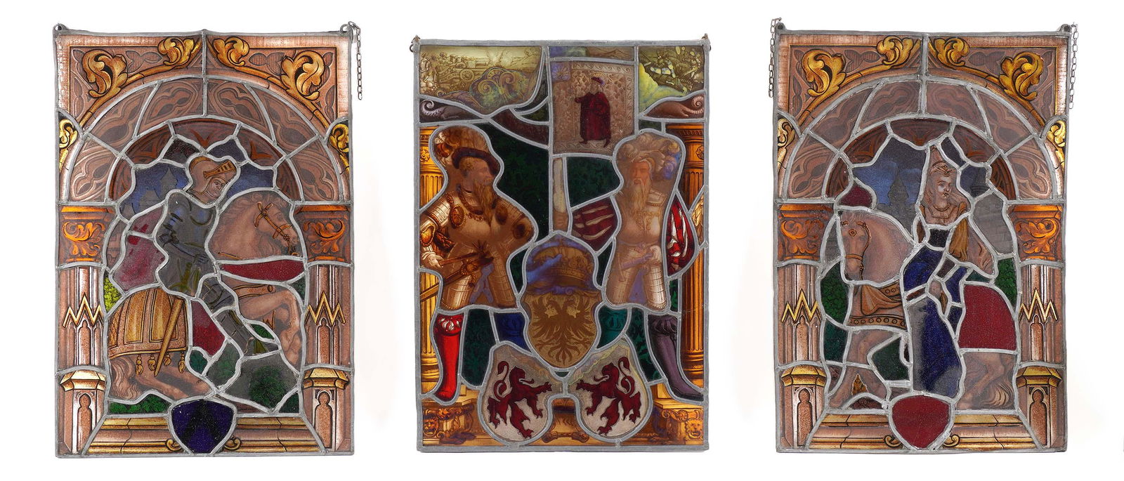Three Medieval Motif Leaded Stained Glass Windows: Three pieces total to include 1) Knight on horseback, 19" x 13". 2) Two soldiers and heraldic shields, 18.5" x 13", one panel cracked. 3) Woman on horseback, 19" x 13". From the estate of a prominent