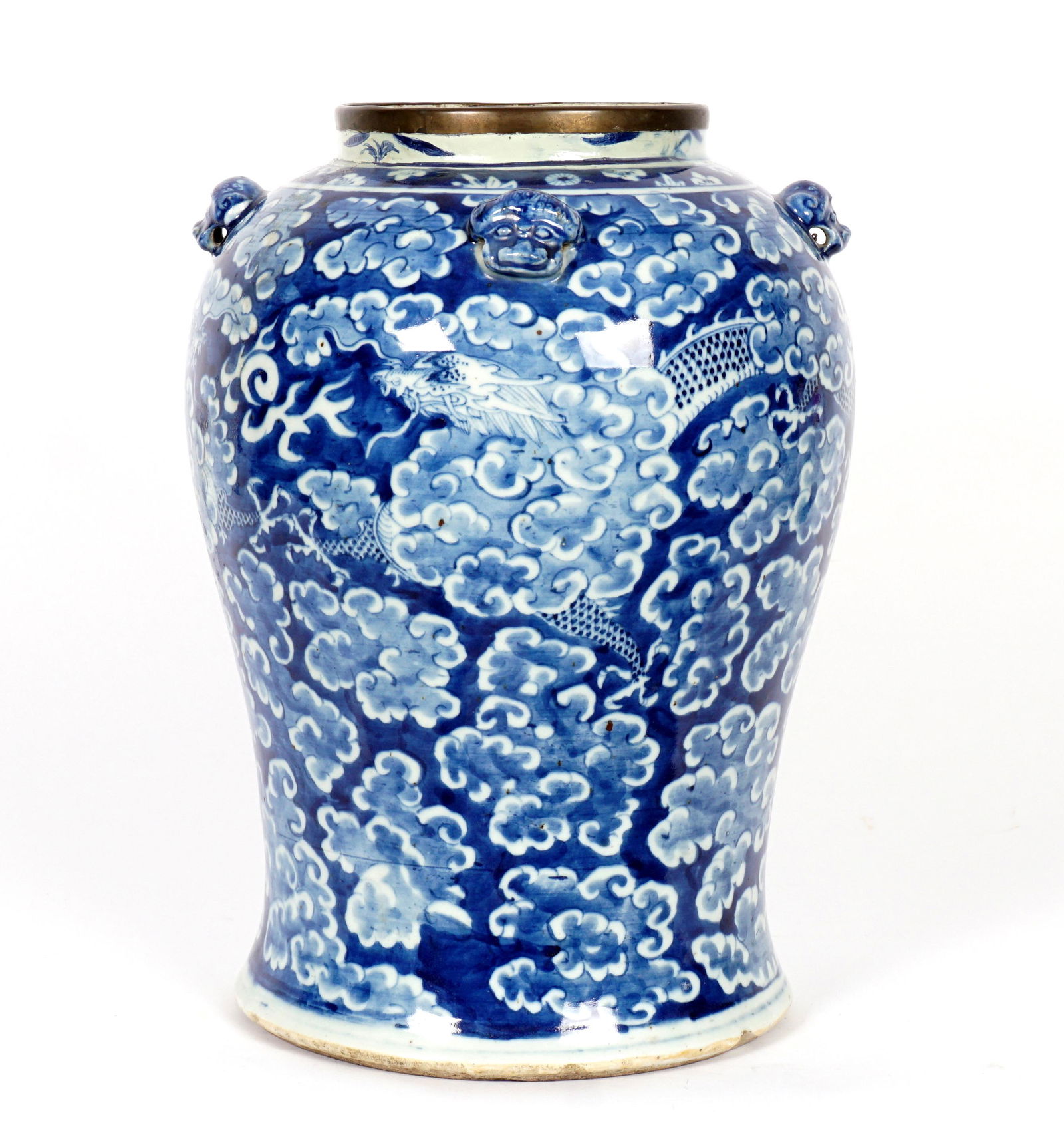 Chinese Qing Blue and White Decorated Dragon Jar: Metal collar over four applied masks at shoulder, baluster form, blue and white decorated with four toed dragons in clouds, unglazed foot, white glazed base, unmarked. Overall 14.25" h. x 10". Conditi