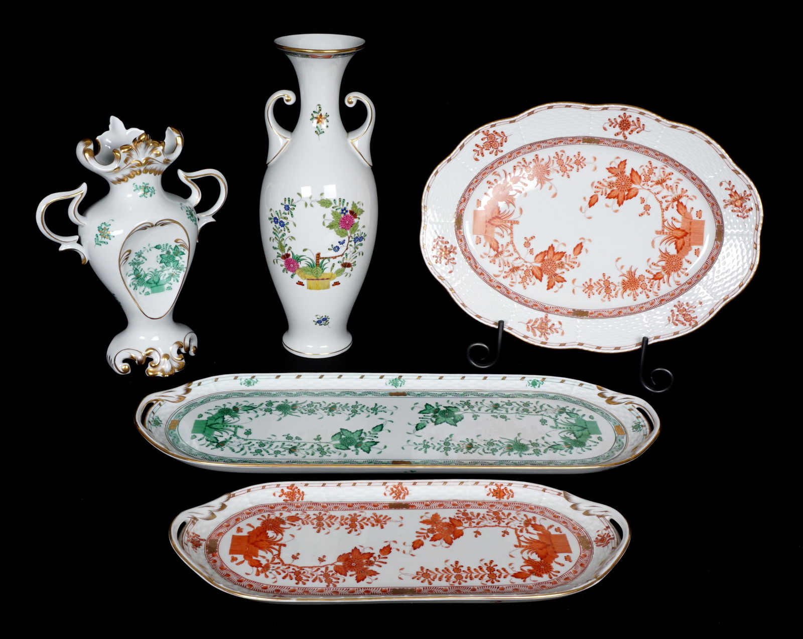 Five Piece Herend Indian Basket Tableware: An assembled collection of five pieces total in the Indian Basket pattern by Herend to include 1) Green elongated tray (19.5" x 6.75"), 2) Green handled vase (10" x 8"), 3) Rust oval platter (13.5" x