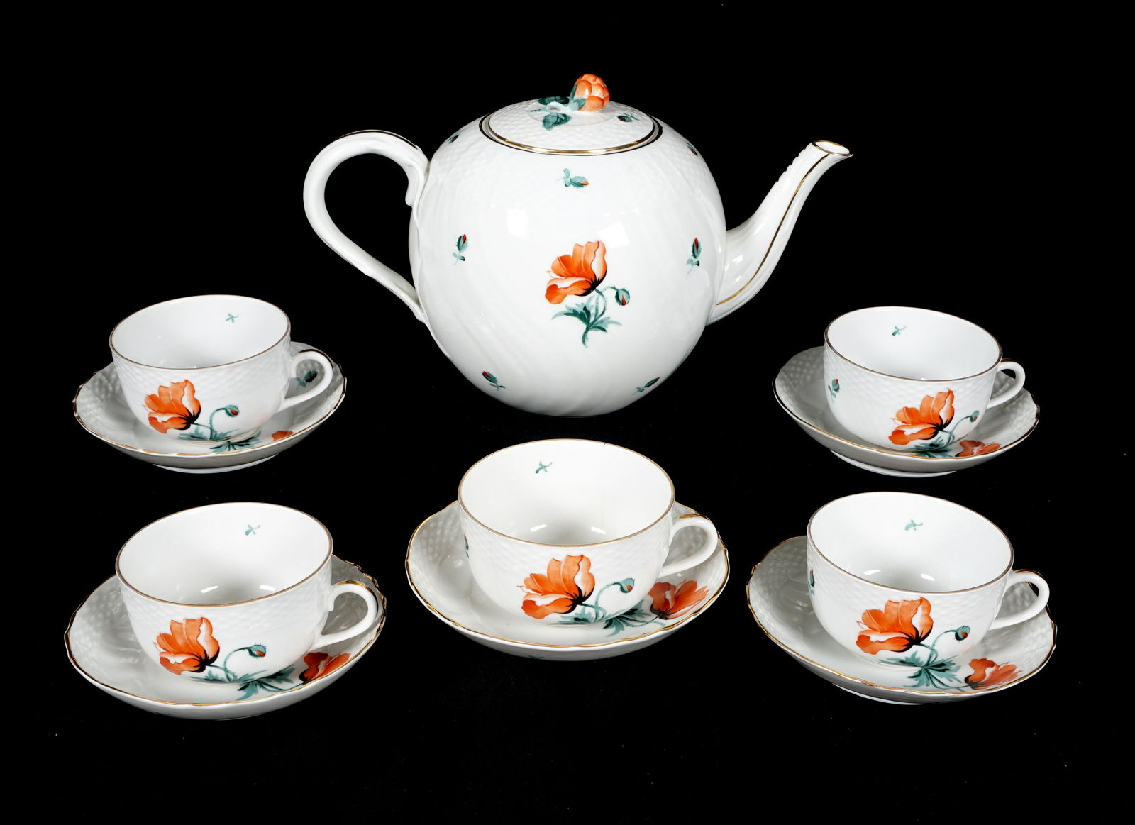 11 Piece Herend Red Poppy Tea Service: 11 pieces total in a red poppy motif to include teapot (6.25" h. x 10"), 5 teacups (2" h.), 5 saucers (5.5" dia.). From the estate of European collector Mark Melamud M.D.
