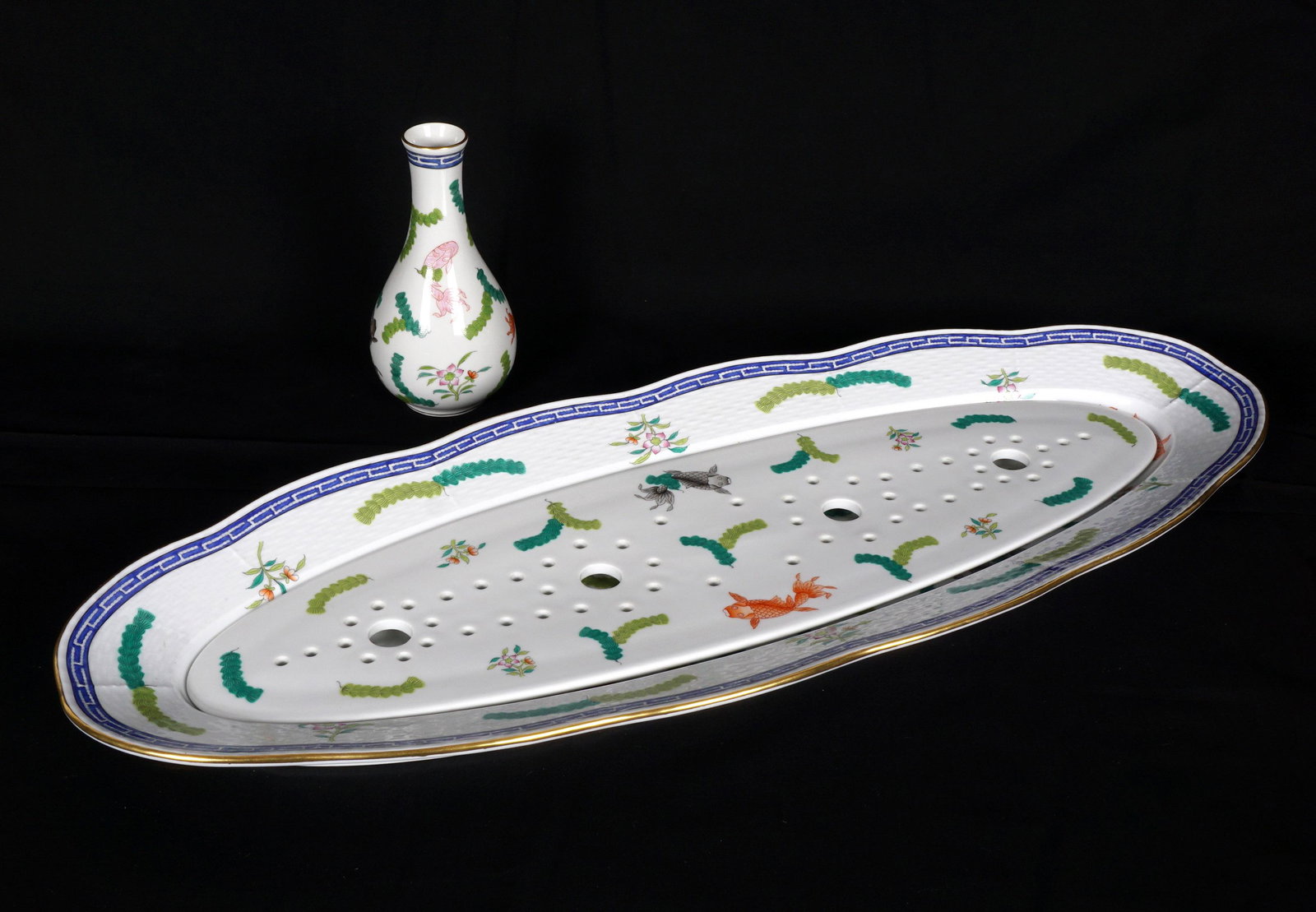 Herend Poisson Fish Service Platter and Vase: Two piece total in the Poisson pattern by Herend to include a fish platter with insert (24" x 9.25"), and a vase (6.25" x 3"). From the estate of European collector Mark Melamud M.D.