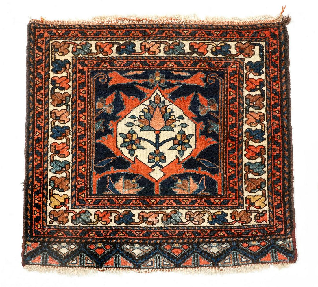 Persian Bag Face Rug: Three foliate and geometric border bands, blue center field, foliate medallion. 2' 1" X 2' 3". Please see photos for condition.
