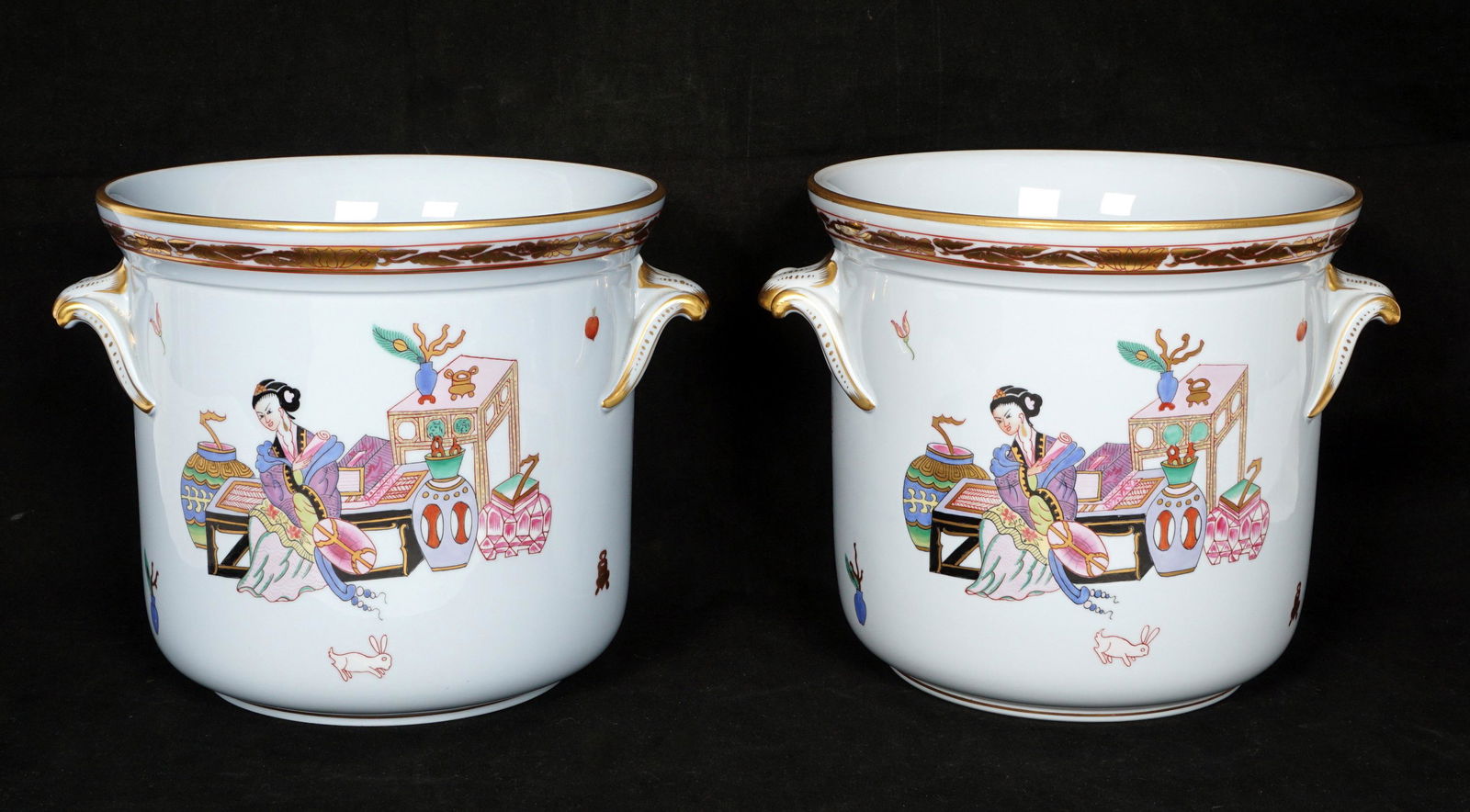 Pair Herend Porcelain Cache Pots: Light blue ground, applied handles, polychrome Chinese genre decoration scenes, flowers, and rabbits, gilt accents, well marked on base, overall 7" h. x 9". From the estate of European collector Mark