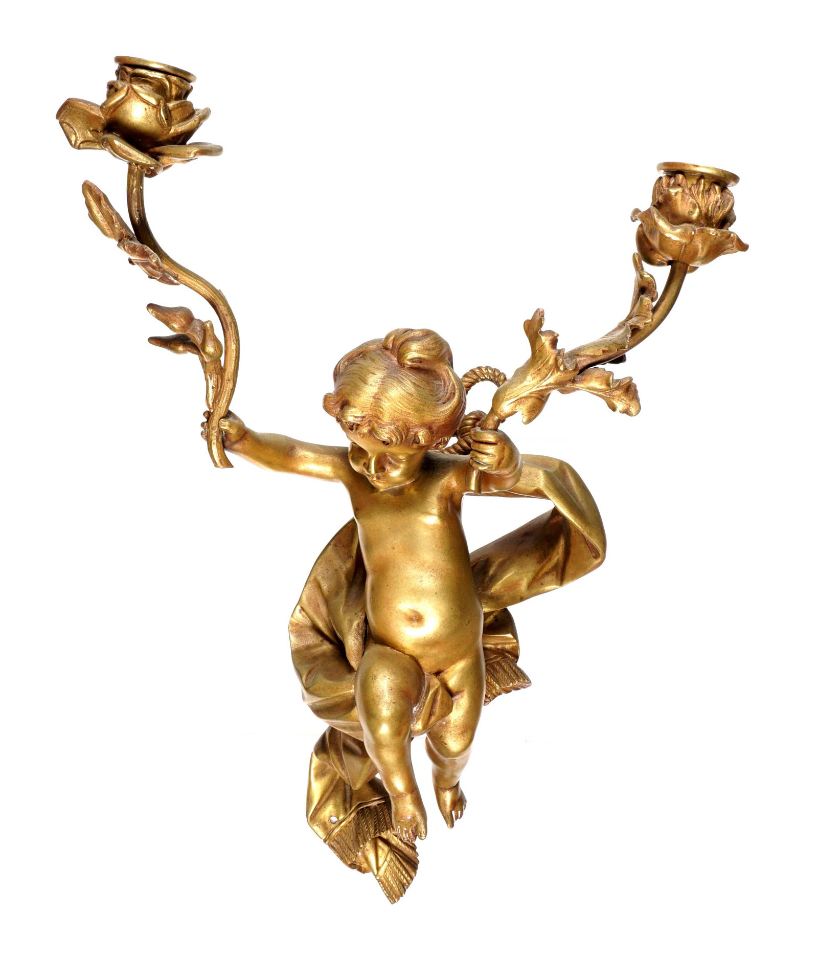 French Gilt Bronze Figural Cherub Two Light Sconce: Figural gilt bronze cherub holding tow foliate and floriform arms, tapestry behind, unsigned, 14.25" h. x 10.25" x 6.25" From the estate of a prominent lawyer from New Rochelle, NY.