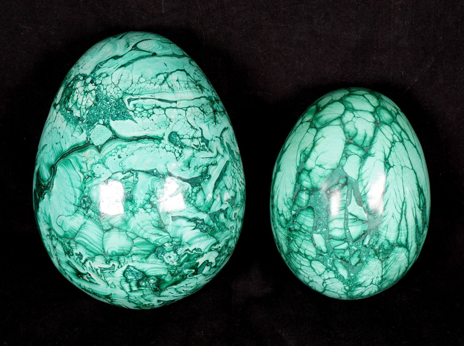 Two Large Malachite Eggs: Two pieces total to include larger 5.5" h. x 4" dia, smaller 4.25" x 3" dia. From the estate of a prominent lawyer from New Rochelle, NY.