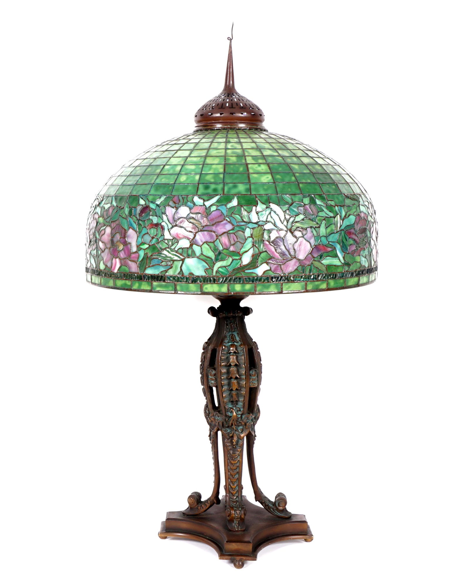 Tiffany Style Leaded Glass Lamp: Heavy cast patinated bronze base, triple socket fixture, unmarked. Leaded and stained glass shade with floral band. Shade measures 35" x 11.5" x 11.5", shade 12.25" x 24.5", pierced brass heat cap 8.5