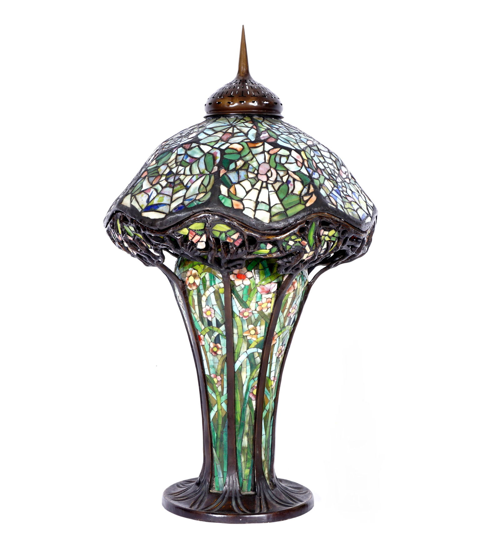Tiffany Style Spider Web Leaded Glass Lamp: Heavy cast patinated bronze base with mosaic glass inserts, triple socket fixture, shaped rim shade support. Conforming rim leaded and stained glass shade with spider web motif. Base measures 22" h. x