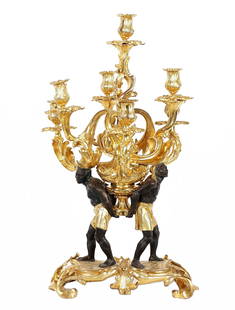 French Cordier Gilt Bronze Blackamoor Candelabrum: CORDIER, Charles Henri Joseph, (French 1827-1905): Gilt and patinated bronze pair of blackamoor figures supporting six foliate scroll and center lights, on foliate foot base, signed Cordier on foot,