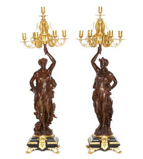 Pair Large Figural Parcel Gilt Bronze Candelabra: Gilt bronze 7 light foliate scroll arm candelabra supported by patinated bronze figural classical maidens signed L. Gregoire. Stepped slate and gilt bronze base, overall 41" h. x 14.5". Condition: