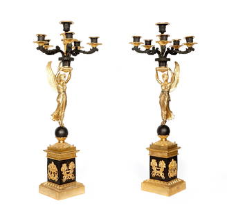 Pair French Parcel Gilt Figural Candelabra: Six light parcel and patinated gilt candelabra, figural winged maiden center, over stepped gilt and patented bronze base, 28" h. x 11". Condition: Verdigris, uneven finish. From the estate of a promin