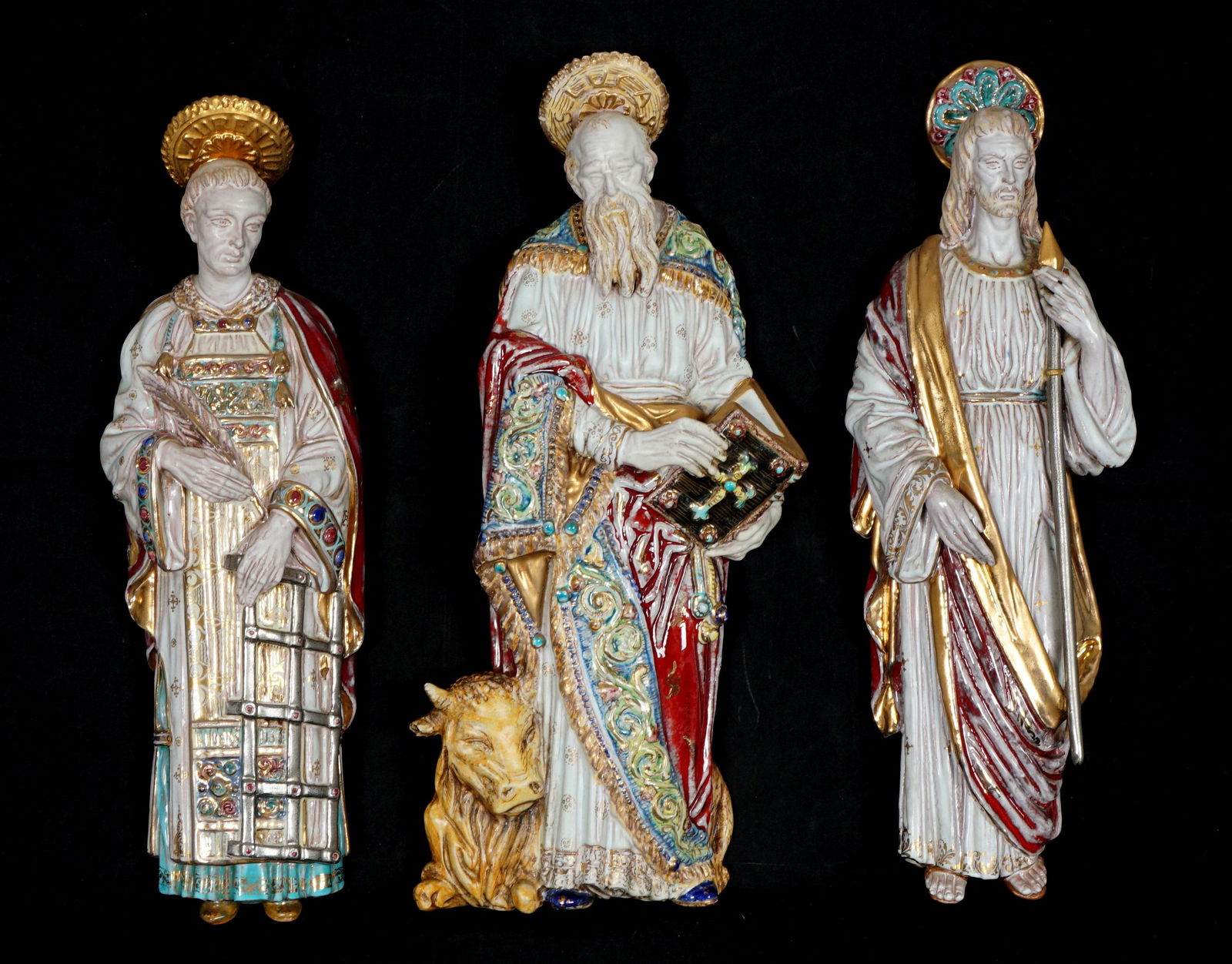 Three Eugenio Pattarino Terracotta Wall Icons: An assembled collection of four Italian polychrome decorated wall icons, each signed Prof. E. Pattarino, Italy, with mold numbers, 15" x 4.75" x 2". From the estate of a prominent lawyer from New Roch