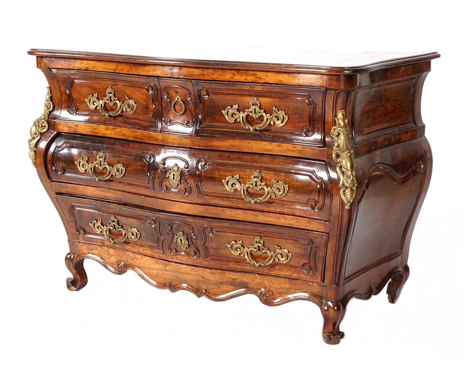 18th Century Walnut French Serpentine Commode: Serpentine top over conforming three drawer over two drawer case, carved and shaped skirt, front scroll feet. Ormolu mounts, handles, and decoration. Overall 36.75" h. x 54.5" x 26". Condition: Dings,