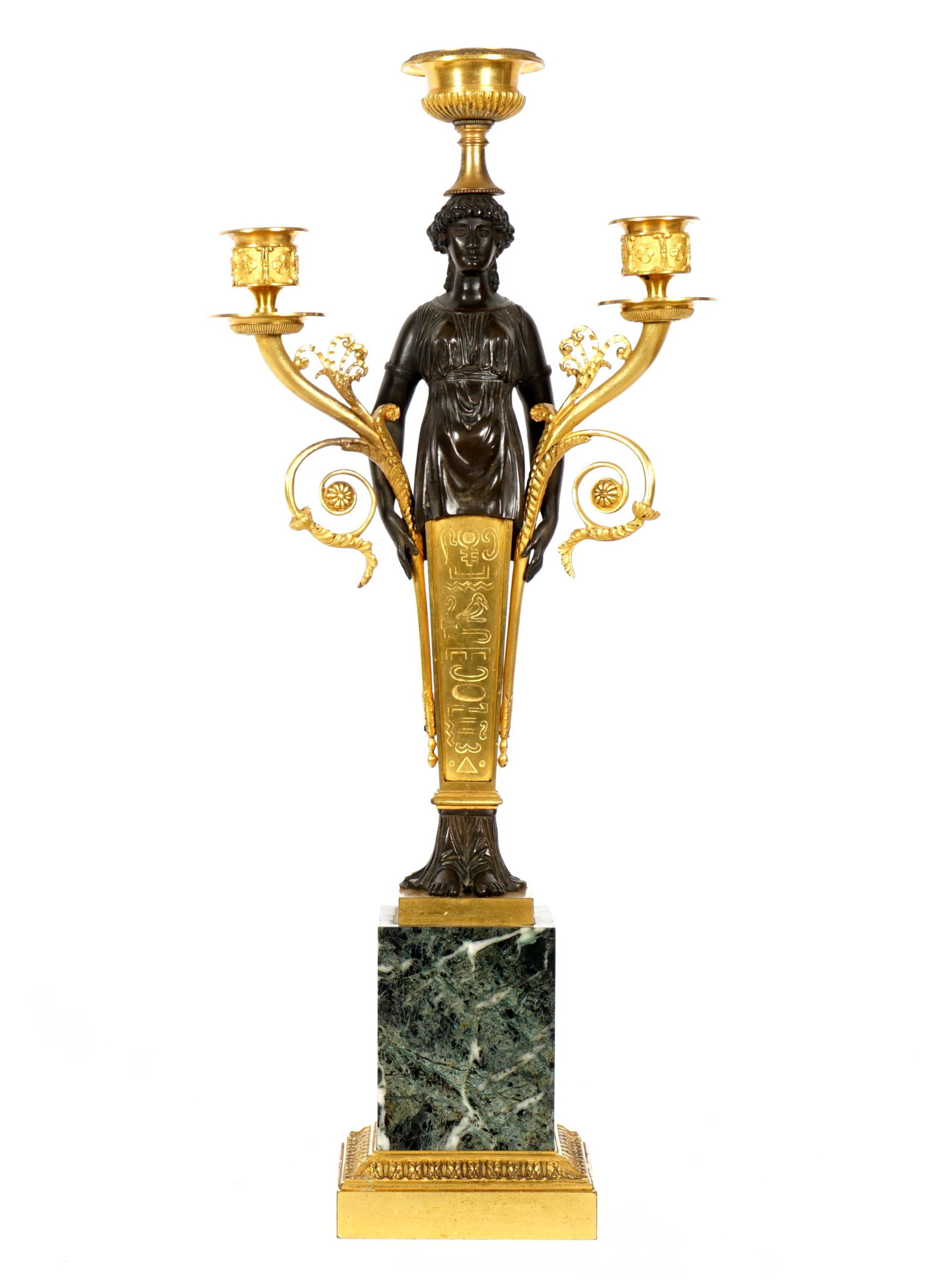 French Egyptian Revival Parcel Gilt Candelabrum: Two gilt bronze foliate scroll arms plus center light finial over patinated bronze maiden. Center gilt bronze panels with hieroglyphics, patinated feet. Affixed to marble plinth, lower gilt bronze bas