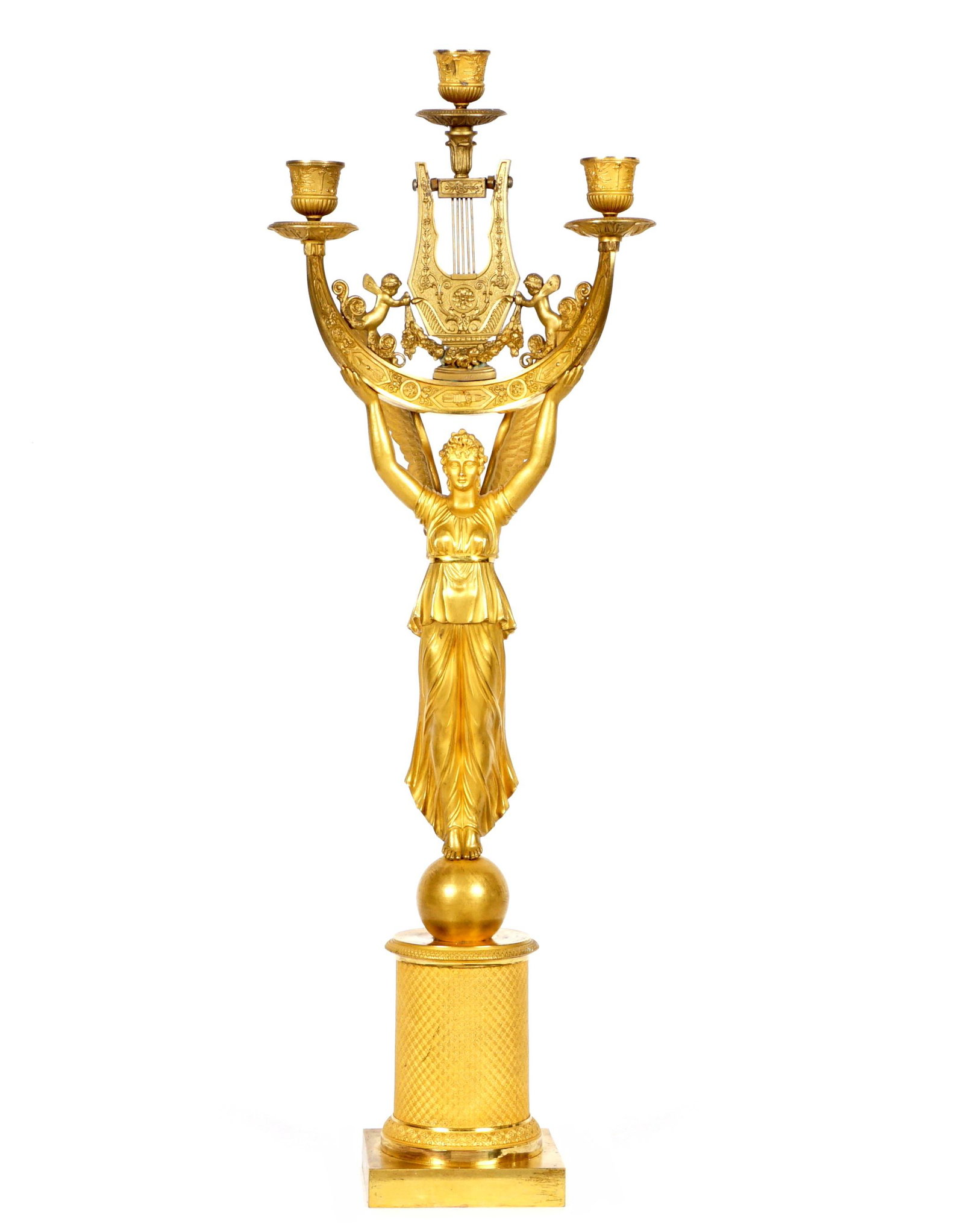 French Figural Gilt Bronze Candelabrum: Gilt bronze candelabrum with figural winged classical maiden supporting candle lights, lyre, and cherubs. Column support on square base, unmarked. Overall 28" h. x 9.5". Condition: repair to center ca