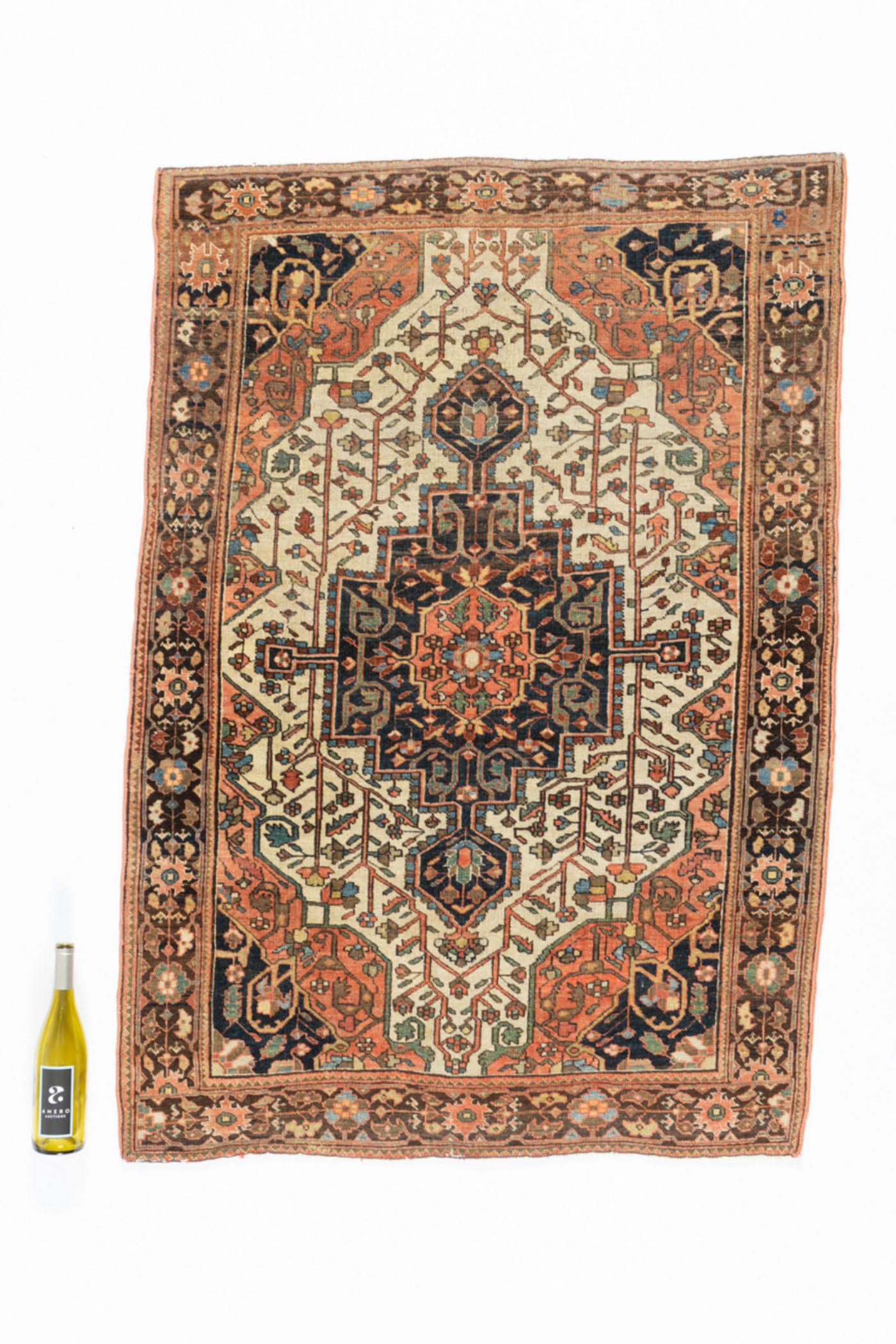 Antique Ivory Sarouk Rug: Floral border band, center ivory field, royal blue center medallion and corners, 3' 5' x 4' 10". See photo for condition.