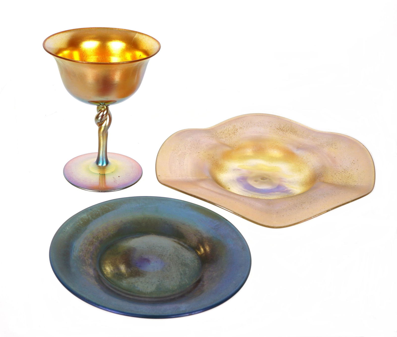 Three Piece Steuben Goblet and Saucers: Three pieces total attributed to Steuben to include 1) Small gold aurene goblet with twist support, marked Aurene, 4.25" h. x 3.25". 2) Opalescent ruffled dish, marked 06148, 6.5" dia. 3) Blue iridesc