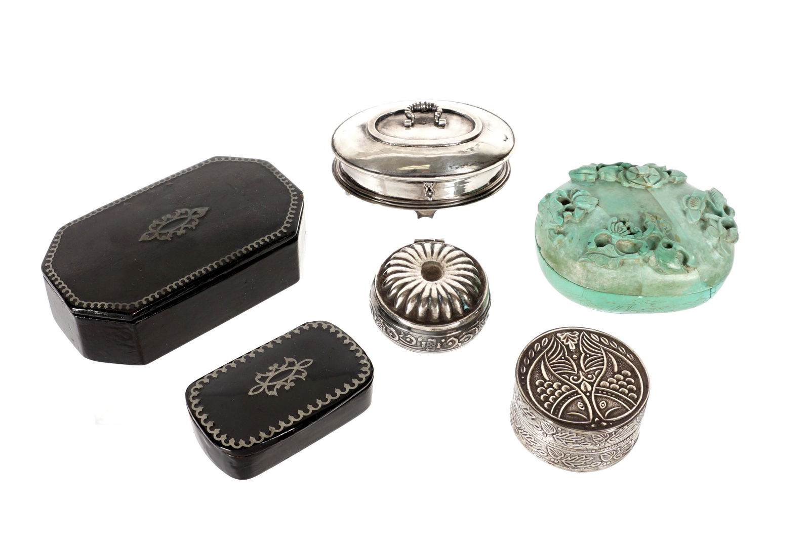 Collection of Six Snuff and Small Boxes: Ana ssembled collection of six total pieces total to include three silver boxes, two inlaid black lacquer, and a carved green stone box. Largest black lacquer measures 1" x 3.5" x 2". Condition: Varie