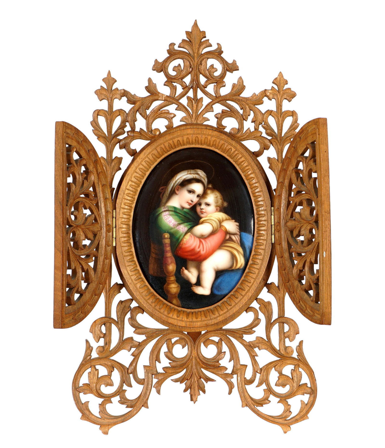 KPM Style Mother and Child Porcelain Plaque: Depiction of the Virgin Mary and Child on oval prcelain plaque, unsigned, 4.5" x 3.5". Reticulated carved wood easel back frame, 11.5" x 6.75". From the estate of a prominent lawyer from New Rochelle,