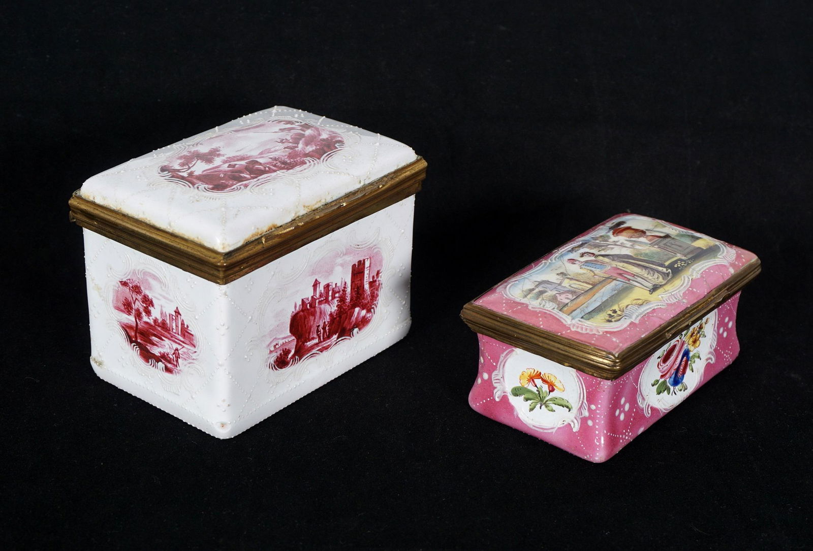 Two Antique Figural Landscape Enamel Snuff Boxes: Two pieces total to include 1) White ground with raised decoration, figural landscapes in reserves on cover and sides, 2.5" h. x 3.25" x 2.5". 2) Salmon pink ground, cover with figures in landscape, s